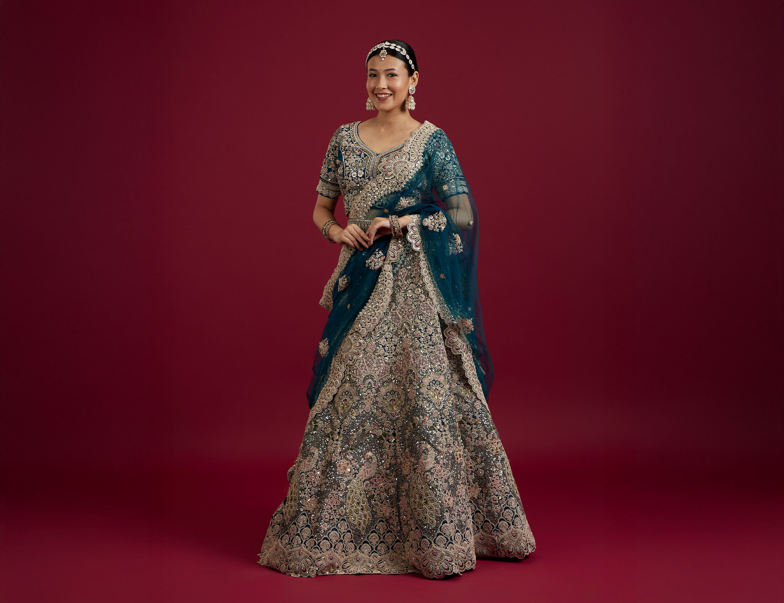 Bride in beautiful sequin lehenga with elegant bridal jewelry